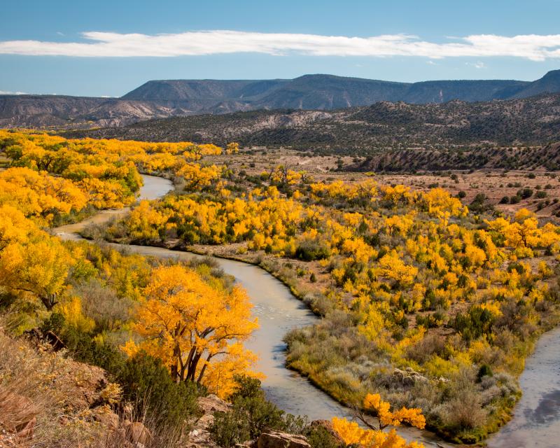 a river winding through an arid and mountainous landscape